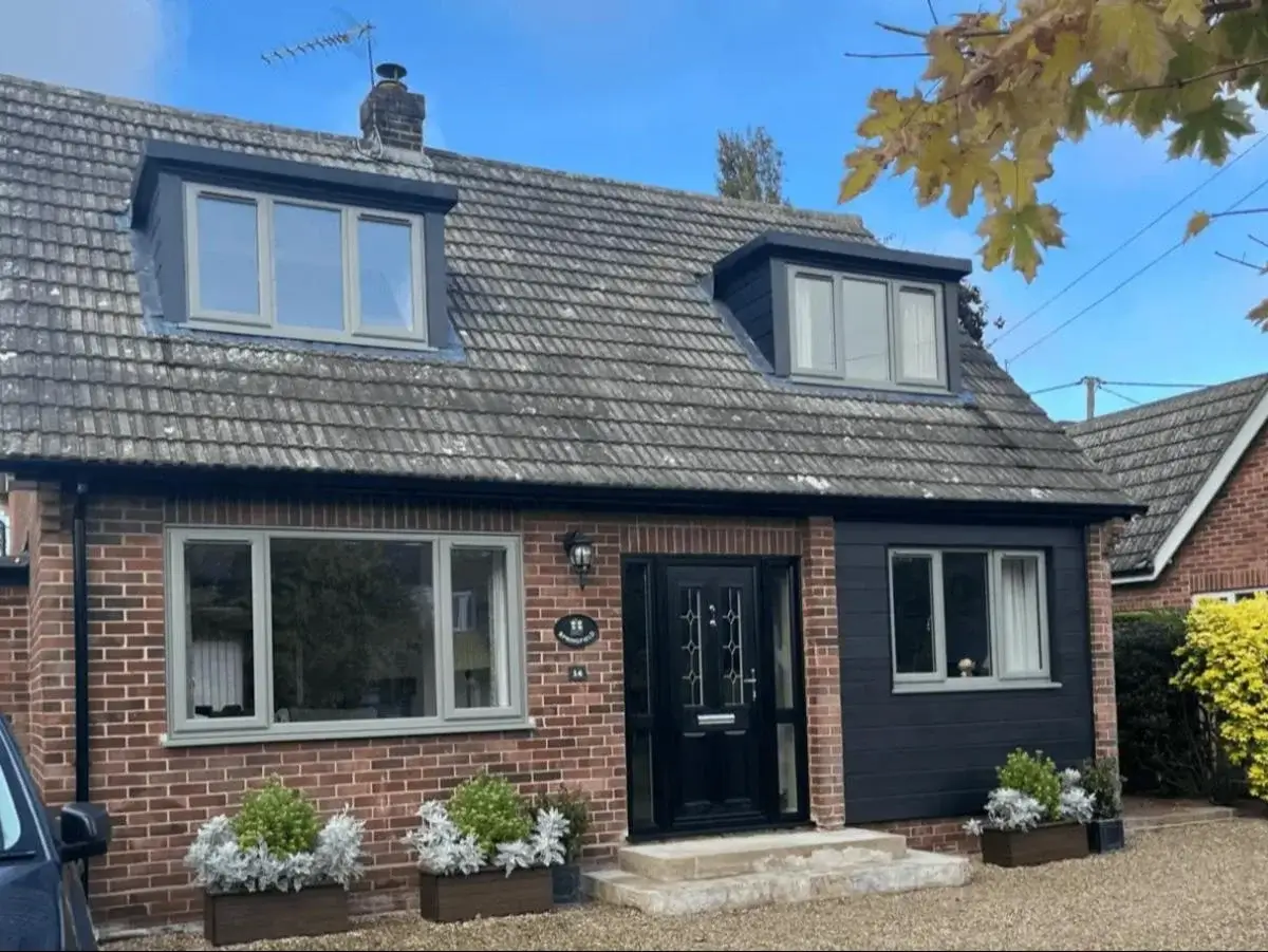 Upgraded residential front facade with energy-efficient concrete grey uPVC windows eliminating internal cold spots in Little Melton. By Norfolk Exterior Solutions